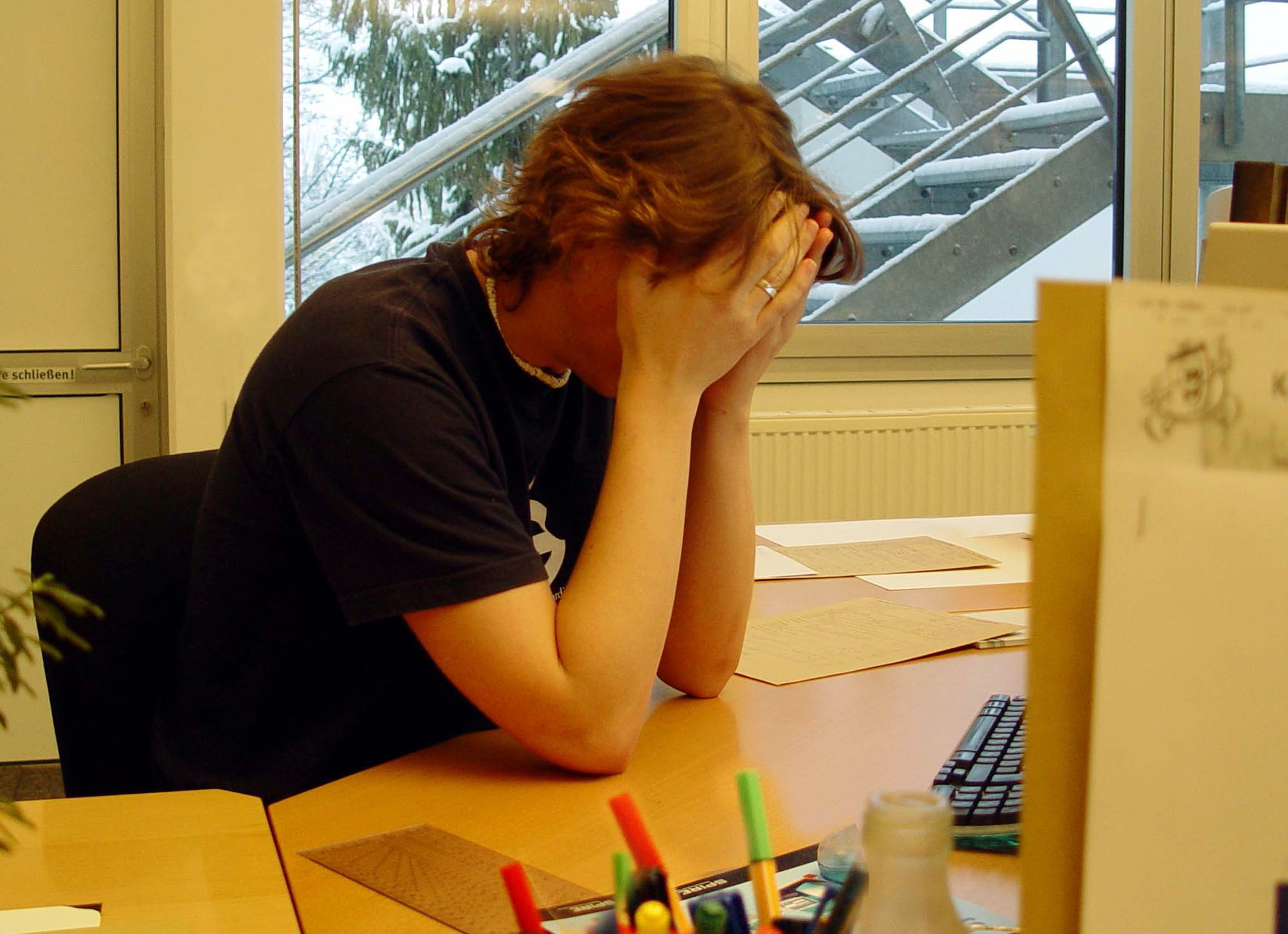 Image of a man with stress associated with cultural adjustment