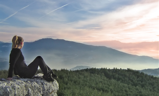 woman looking over mountains